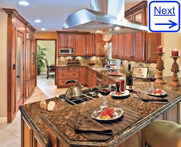 Luxury Kitchen Photos: Maple Cabinetry and Distinctive Vent Hood